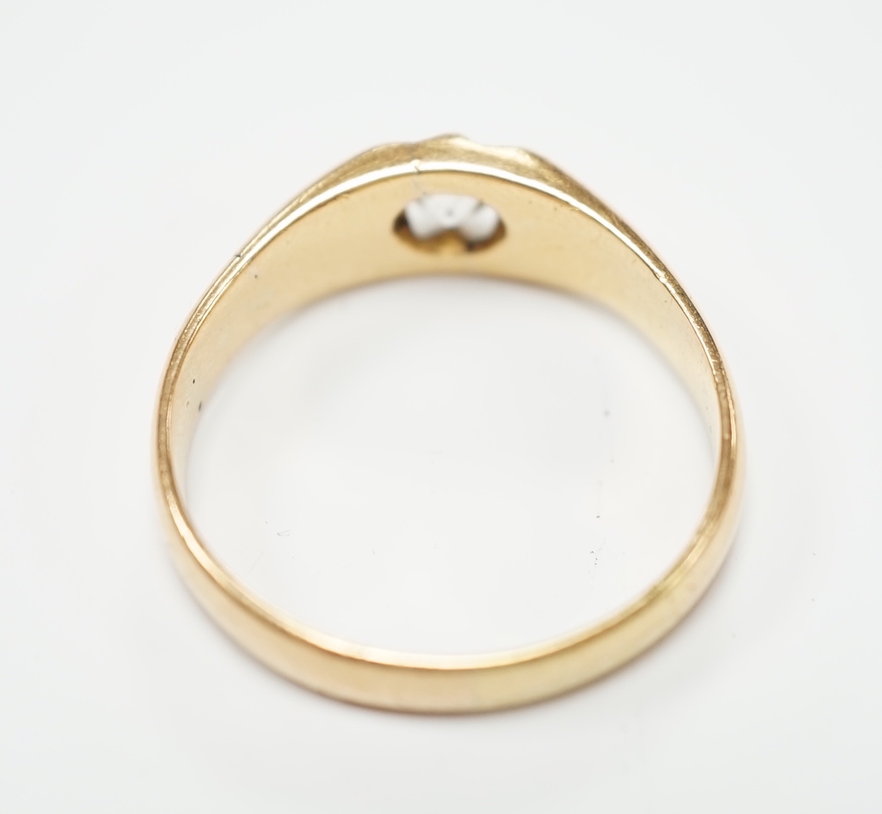 A George V 18ct gold and claw set solitaire diamond ring, size W, gross weight 7.2 grams.